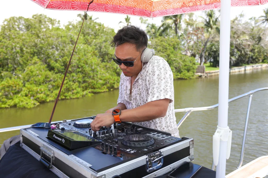 DJ performing aboard a Reel Action yacht